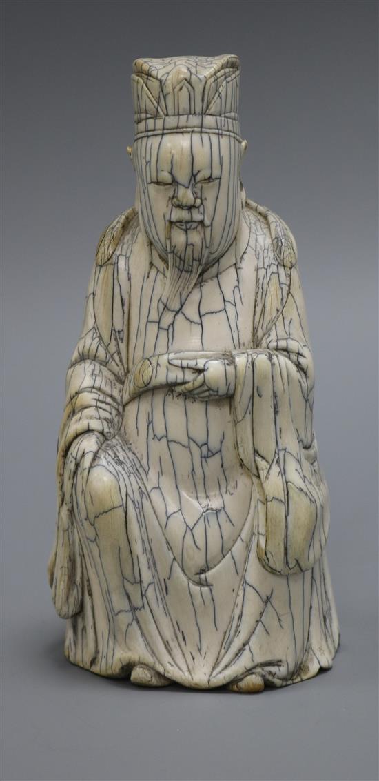 A Chinese ivory figure of an immortal, possibly Guandi, early 20th century, in Ming style, height 17cm